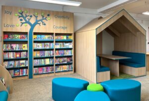 Wall shelving and reading house in school library