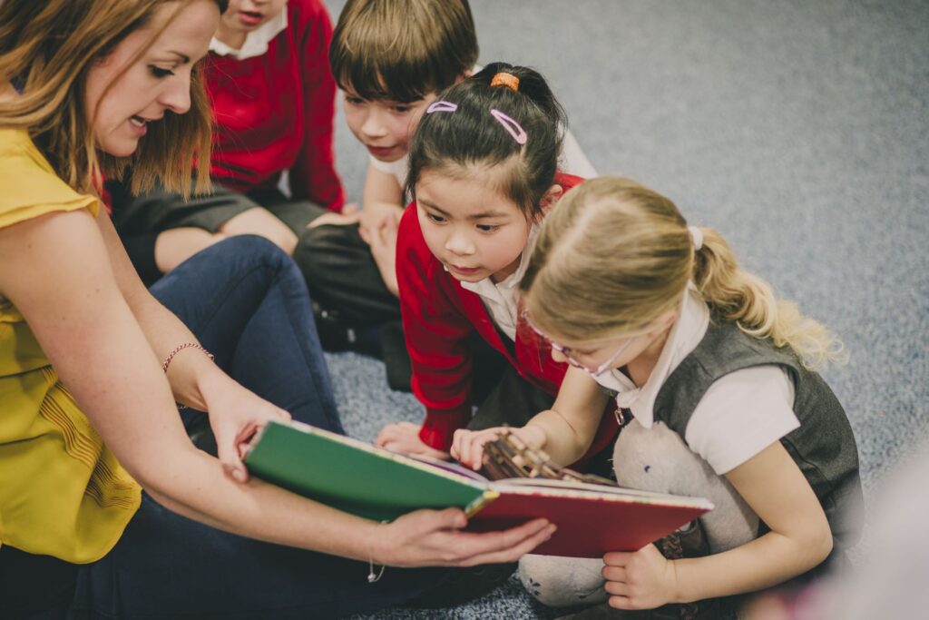 Teacher reading to primary school children
