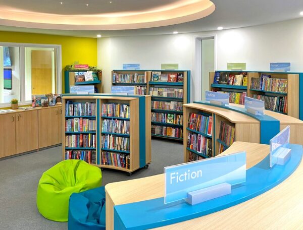 school library bookcases with signage