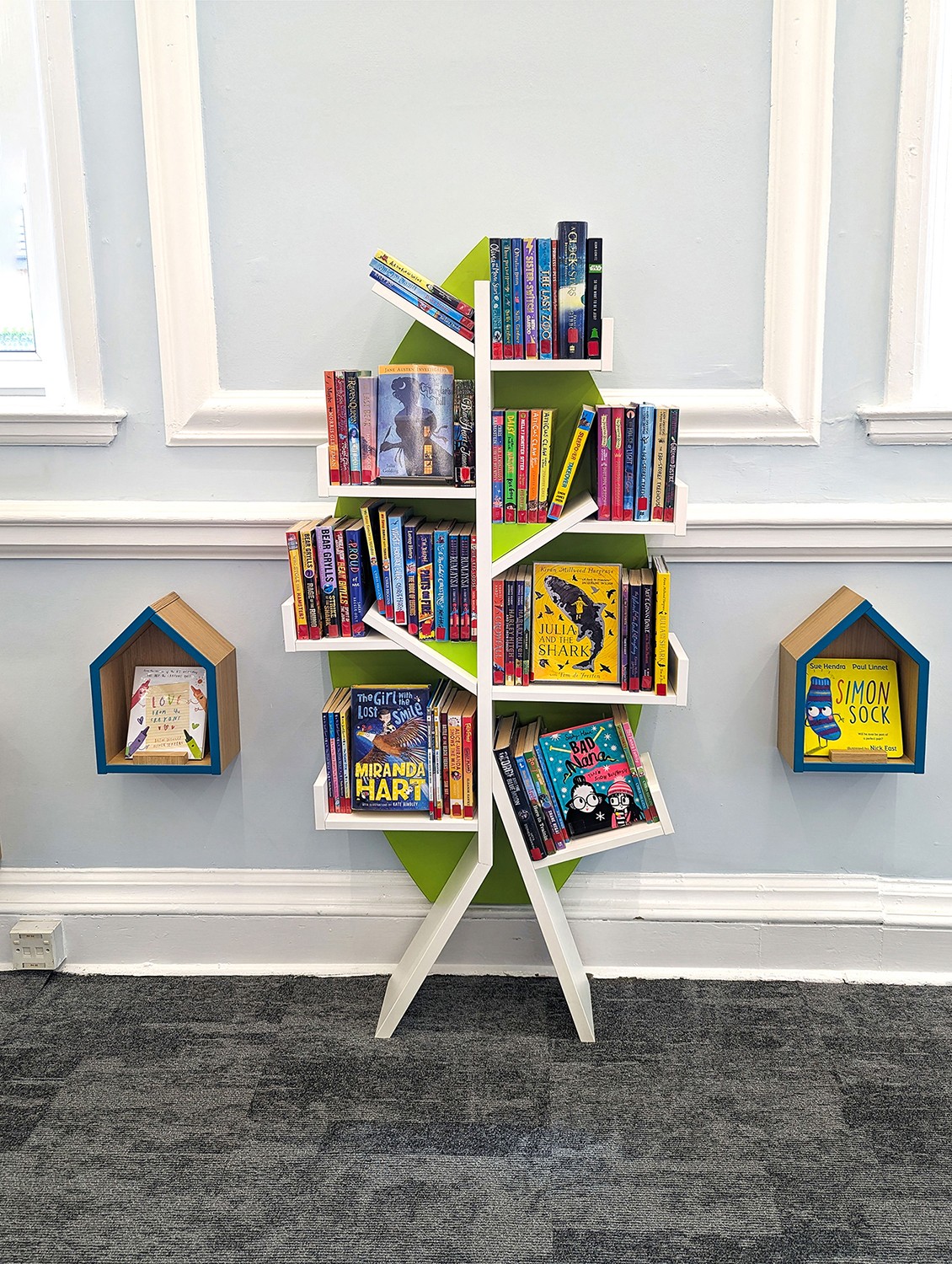 wall-mounted book tree tree shelf in children's library