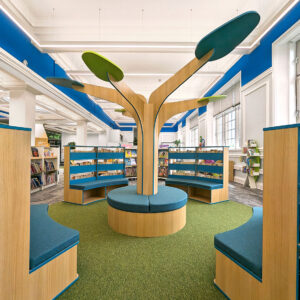 central feature tree in Motherwell Children's Library surrounded by curved shelving and seats