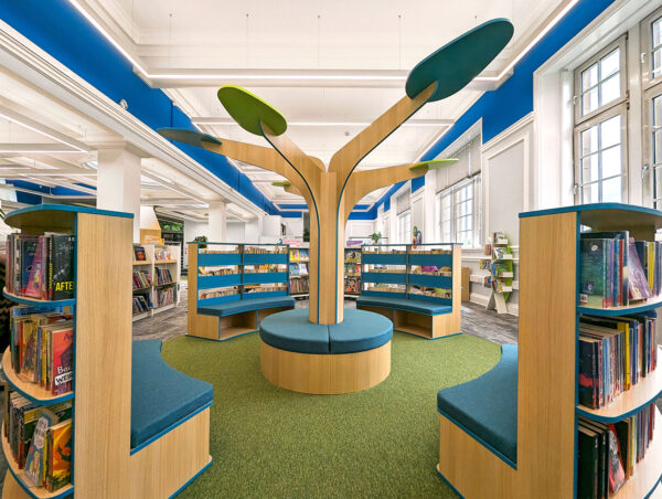 central feature tree in Motherwell Children's Library surrounded by curved shelving and seats