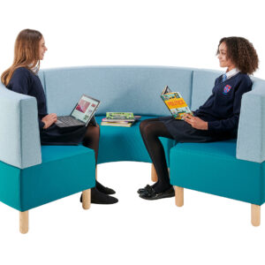 Teenagers sitting and reading on inner curved seats in school library