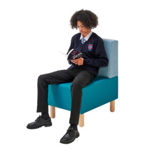 Student sitting on single seat in library