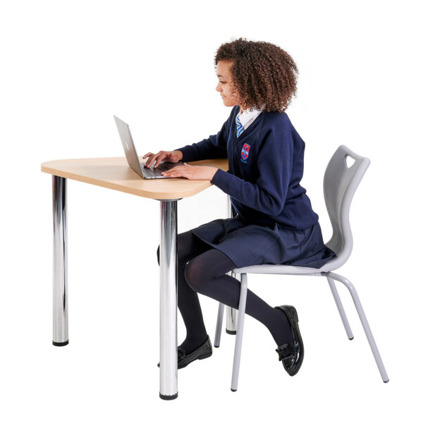 Student using triangular desk and chair