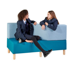 Teenagers sitting on s-curved seat in school library