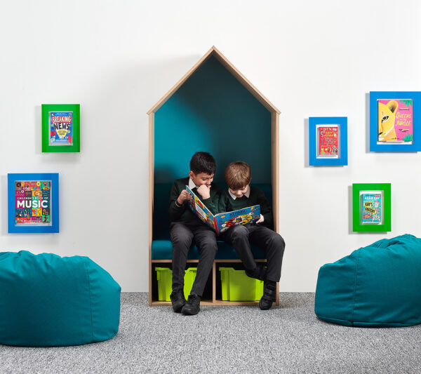 boys children reading in nook cubby house primary school library