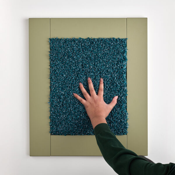 child touching tactile carpet textured sensory frame