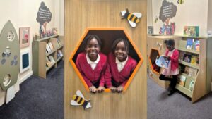 children in school reading corridor library